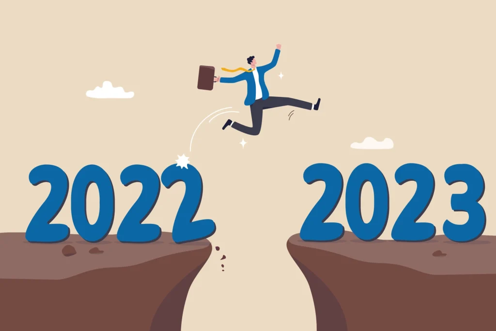 happy new year 2023 hope for business success new year resolution or opportunity motivation and work enjoyment concept happy businessman jump cross the gap from year 2022 to 2023 vector